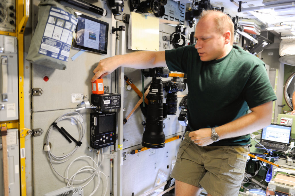 Russian cosmonaut Oleg Kotov in the Zvezda Service Modul of ISS with the TRITEL instrument, source: NASA
